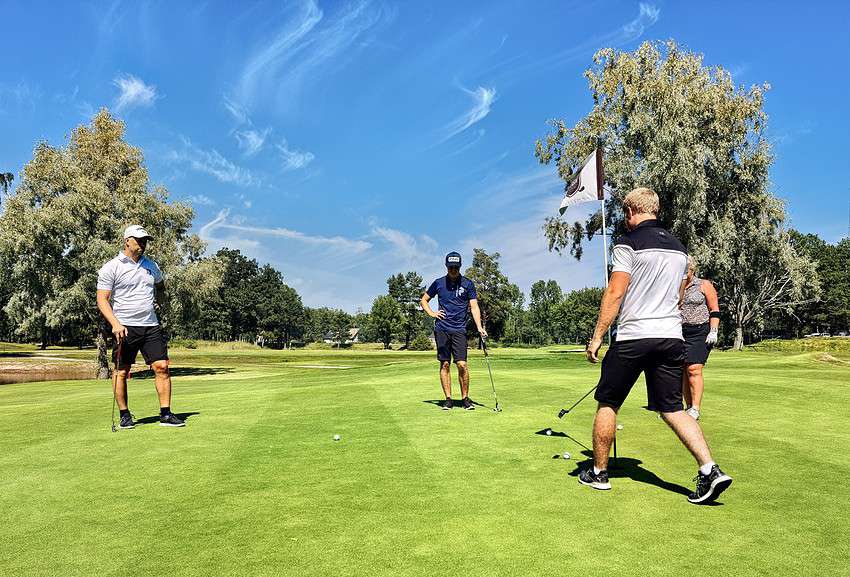 Photo by Martin Magnemyr: https://www.pexels.com/photo/people-on-a-golf-course-green-5044298/